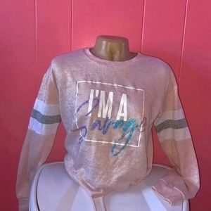 A pink size small sweatshirt.